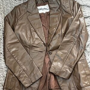Wilson’s brown leather jacket